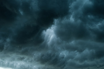 Wall Mural - dark clouds and thunderstorm with rainy, dramatic black clouds in summer