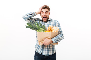 Poster - Portrait of a surprised man holding paper bag