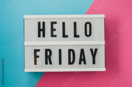 Fotografía Hello Friday- text on a display on blue and pink bright background