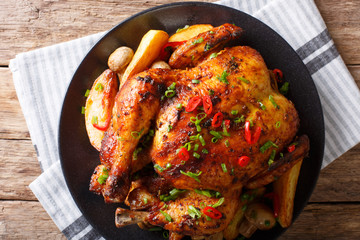 grilled chicken with fried mushrooms and potatoes close-up. horizontal top view