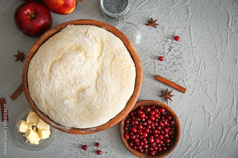 Composition with fresh raw dough on table
