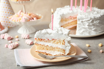 Canvas Print - Piece of birthday cake with candle on table