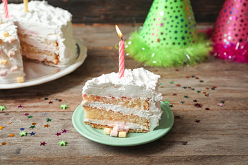 Canvas Print - Piece of birthday cake with candle on table