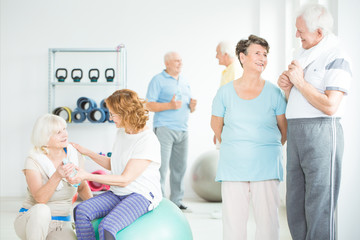 Wall Mural - Elders in sportswear at gym