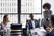 © Cavan Images - Business people having meeting in office