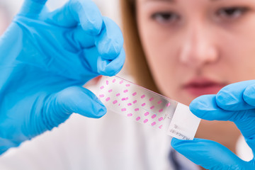 Poster - technician in the lab preparing slides Tissues for microscope