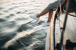 © Kateryna - Legs of a girl in white sneakers, which is sits on a yacht and enjoys the sunset