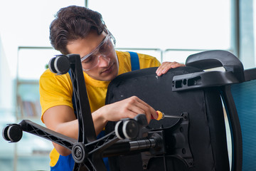 Furniture repairman working on repairing the chair