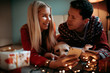 © SVP Productions - Christmas gifts and happiness between a young couple and a cute dog