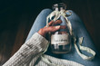 © Kelly Knox/Stocksy - woman holding a bottle filled with hopes and dreams