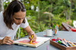 © Jovo Jovanovic/Stocksy - Young artist drawing in his notebook