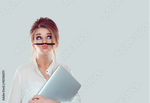 Fotografie, Obraz Annoyed woman, funny student with laptop computer playing holding pen between no