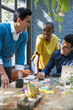 © Jovo Jovanovic/Stocksy - Group of young colleagues at meeting