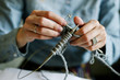 © Toma Evsiukova/Stocksy - Girls hands knitting close up