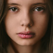 © Andrei Aleshyn/Stocksy - face of a beautiful young girl close-up