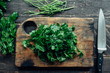 © Gabriel (Gabi) Bucataru/Stocksy - Fresh parsley leaves on a chopping board