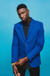 © BONNINSTUDIO/Stocksy - Portrait of man wearing a blue suit