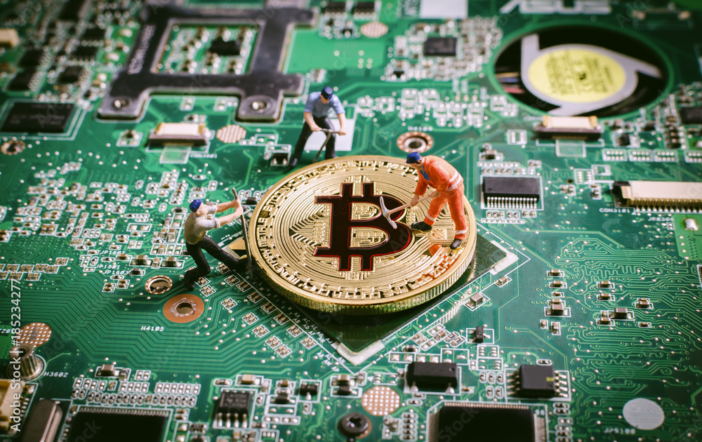miniature miner worker teamwork digging for golden bitcoin on circuit board. digital currency blockchain crytocurrencies concept