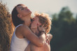 © Nickolay Khoroshkov - Couple in love dating and kissing at the hay