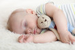 © Oksana Kuzmina - Cute baby boy sleeping with little toy