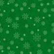 Zielone śnieżynki na zielonym tle. Tło bezszwowe święta Bożego Narodzenia