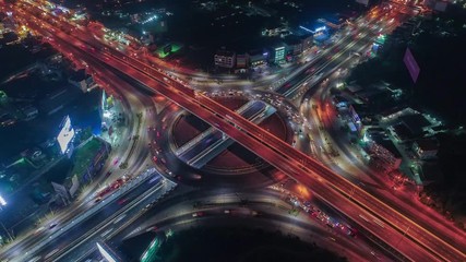 Wall Mural - Time lapse,Hyperlapse ,Of traffic on city streets at night. Aerial view and top view of traffic on freeway, 4K.