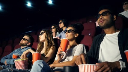 Sticker - Young bored multiethnic spectators in 3d glasses watching film in cinema