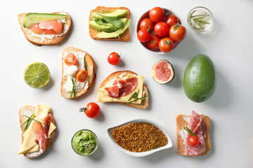 Poster - Delicious sandwiches on white background, top view