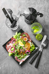 Wall Mural - Plate with delicious fresh salad on table