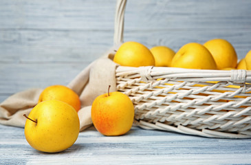 Poster - Ripe yellow apples on table