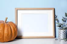 Mockup Of Blank Frame With Pumpkin On Color Background