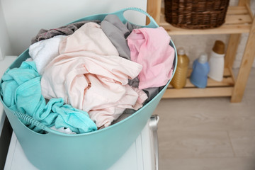 Wall Mural - Basket with laundry on washing machine in bathroom