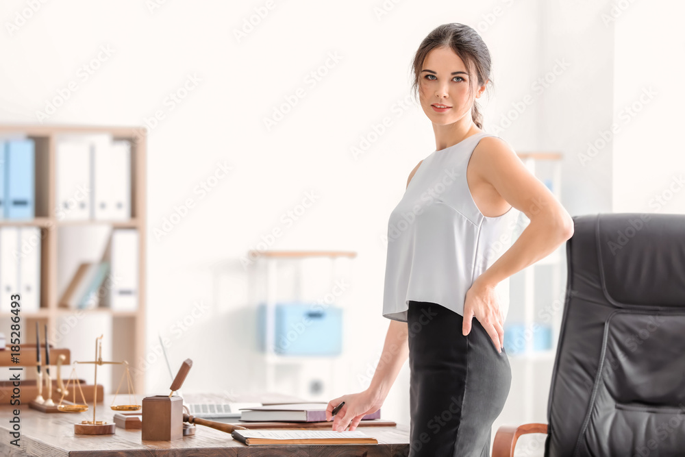 Young female notary in office