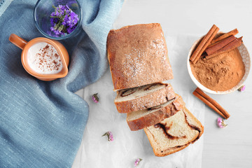 Wall Mural - Delicious cinnamon roll cake on table