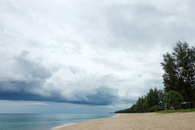 Dramatic Seascape. Deserted Beach And Forest In Thailand And Thunder Sky.