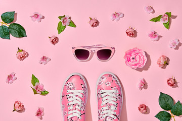 Fashion Woman Accessories Set. Pink Pastel Color. Flat lay. Minimal Style. Trendy fashion Sneakers, Glamour Summer Sunglasses. Roses Flowers, leaves. Spring Floral