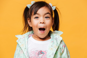 Shocked little girl child standing isolated