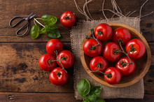 Tomatoes And Basil In Wooden Bowl