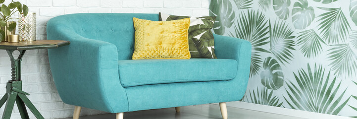 Wall Mural - Yellow pillow on blue settee