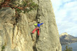 © Vitalii Nesterchuk - Rock climber ascending a challenging cliff. Extreme sport climbing. Freedom, risk, challenge, success.
