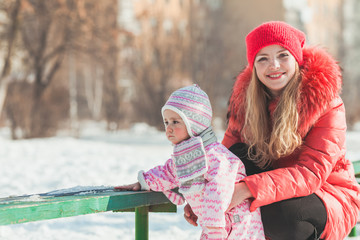 Wall Mural - Mother and daughter enjoying winter