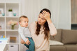 © Syda Productions - tired mother with baby boy at home