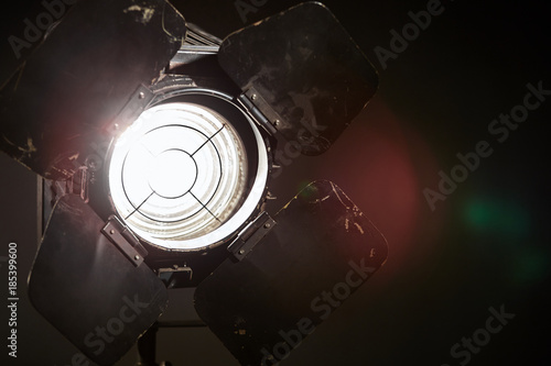 Fotografie, Obraz Old film projector/ Old film projector shines in the studio