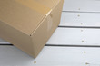 © Fernando Cruz - Cardboard delivery parcel box delivered to doorstep closeup