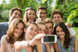 © jackfrog - Group of young people taking a selfie outside
