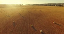 Aerial View Hay Bales In Agriculture Field At Sunset In Rural California 4K UHD
