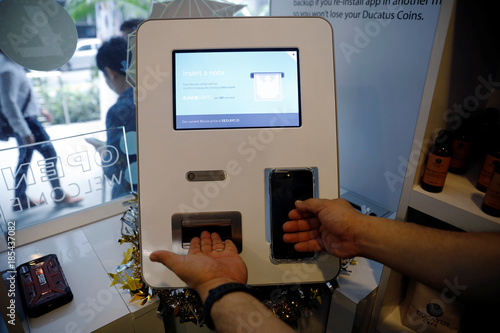 Ducatus Franchise Manager Philip Lim Shows How He Makes A Deposit At - 