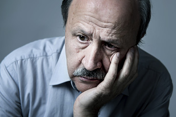 Wall Mural - head portrait of senior mature old man on his 70s looking sad and worried suffering Alzheimer disease