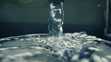 Stream Of Water Running In Kitchen Sink  Slow Motion Abstract Background