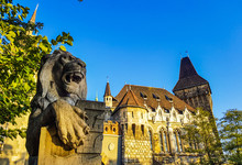 Famous Castle In Budapest - Vajdahunyad With Lion Monument In Front